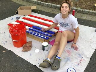 Isabella Marino raised funds for Eva's by breathing new life into some old pallets donated by LL Flooring. Marino, a rising senior at Academy of the Holy Angels in Demarest painted and sold a pallet a day for 30 days.